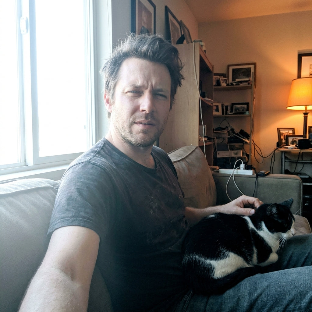 files/Man_sitting_with_cat_99b5e2f2.jpg